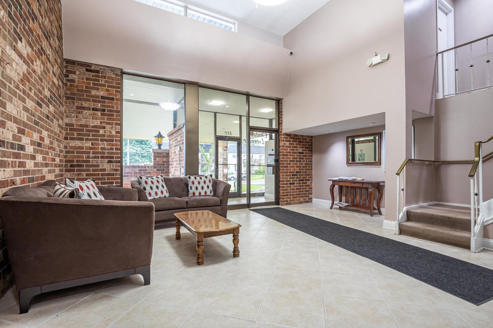 850 South Lorraine Road, Unit 1J Wheaton, IL 60189 - Photo 21 of 22 a living room with furniture and a fireplace