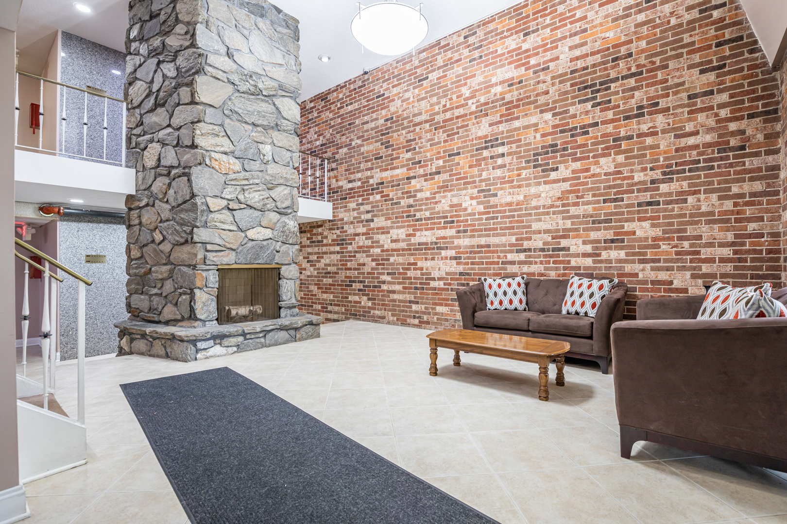 850 South Lorraine Road, Unit 1J Wheaton, IL 60189 - Photo 22 of 22 a outdoor living space with furniture and a fireplace