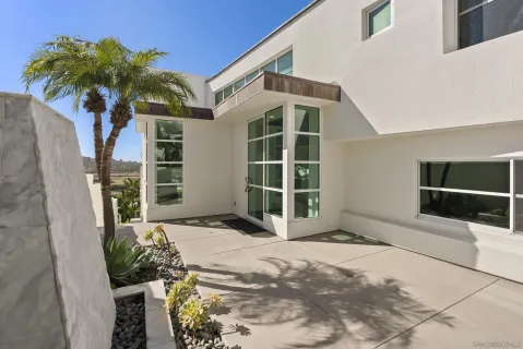 a view of front door and yard
