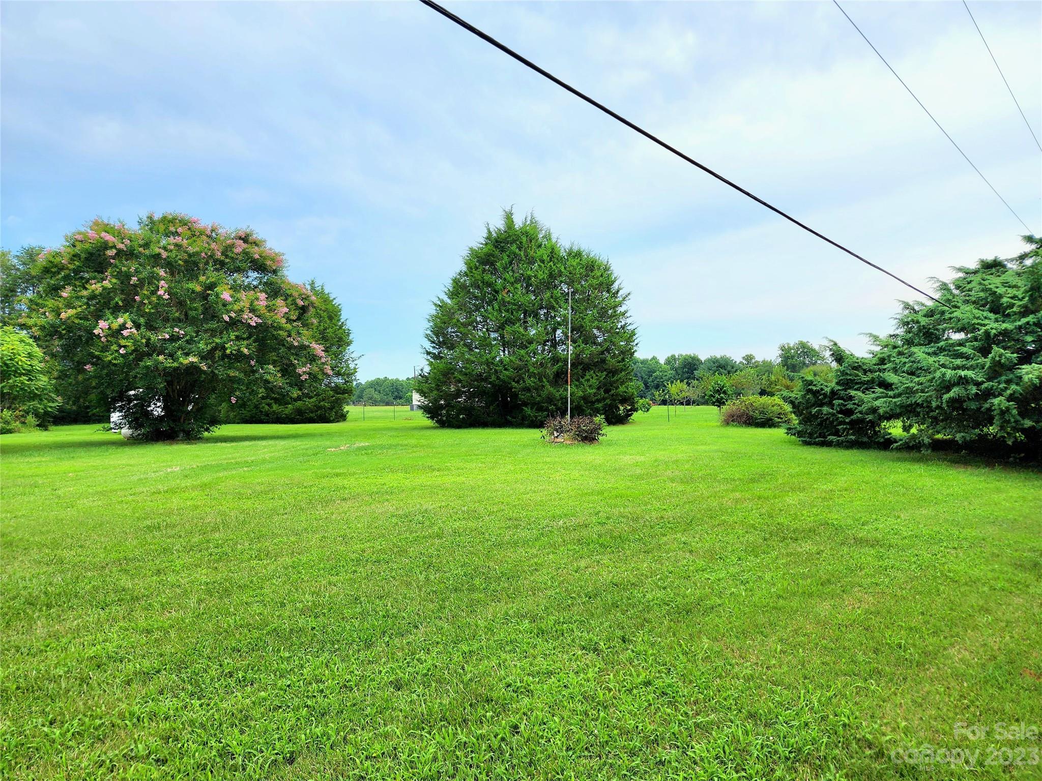 6806 Lackey Road Vale, NC 28168 - Photo 18 of 21 a view of a field of grass and trees