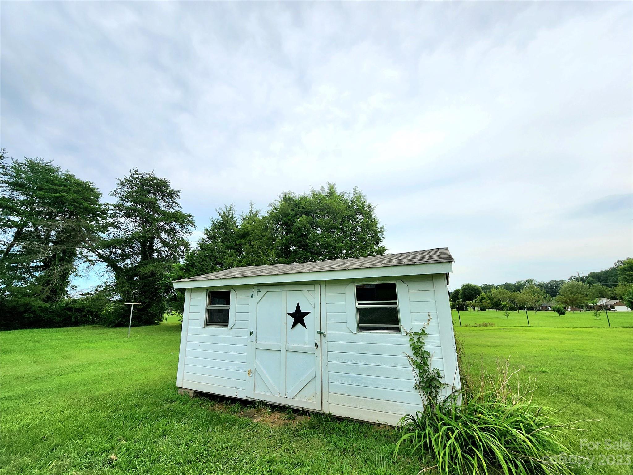 6806 Lackey Road Vale, NC 28168 - Photo 20 of 21 a view of a backyard with a garden