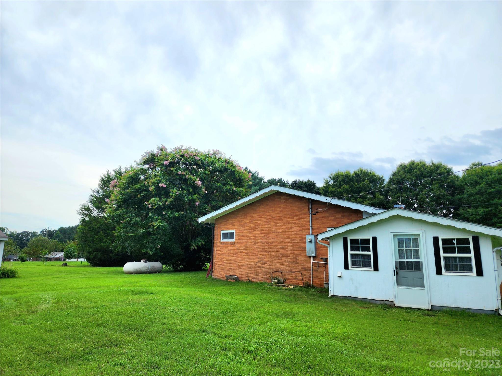 6806 Lackey Road Vale, NC 28168 - Photo 2 of 21 a front view of house with yard and trees in the background