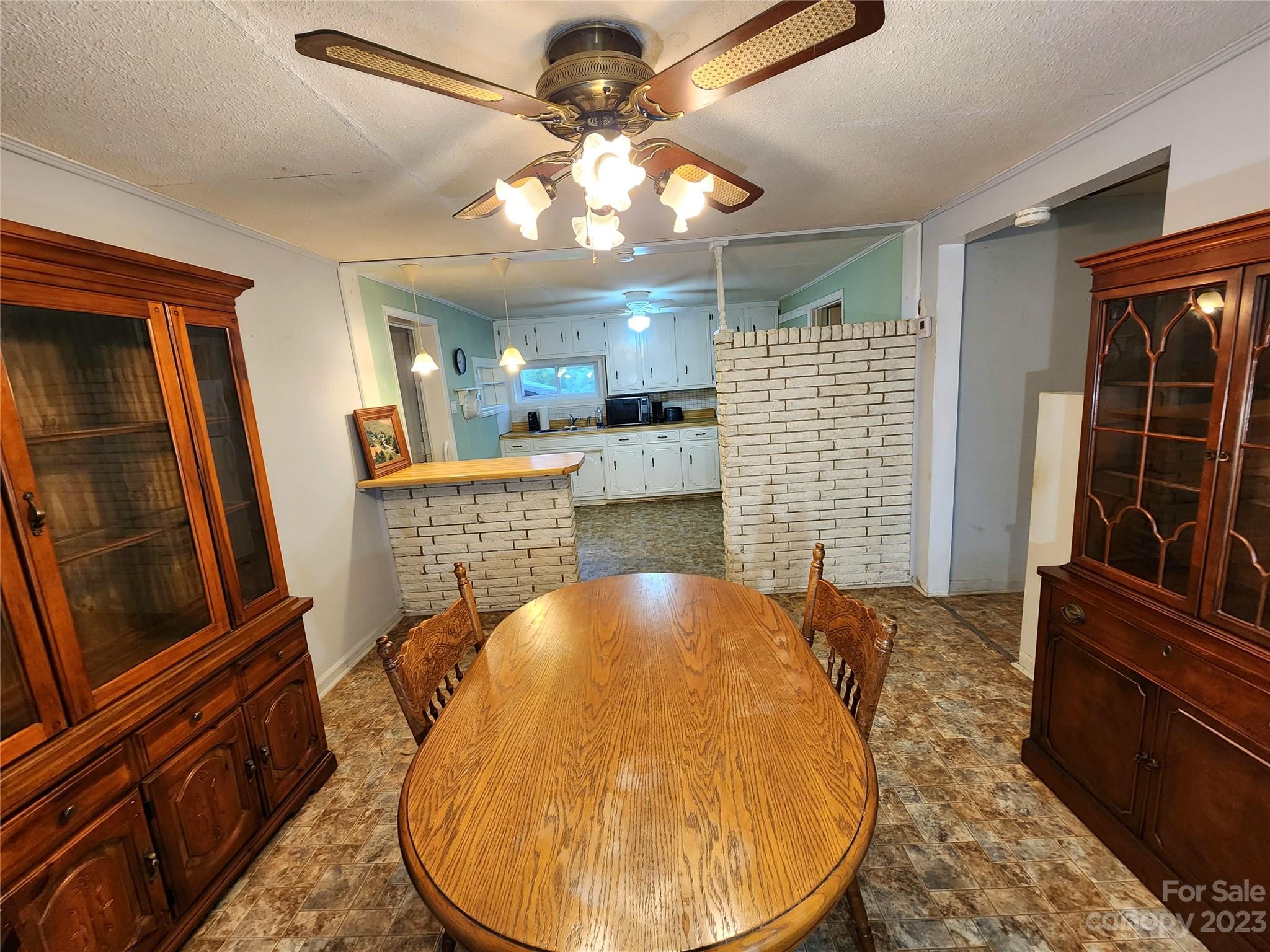 6806 Lackey Road Vale, NC 28168 - Photo 4 of 21 a view of kitchen and dining room with wooden floor