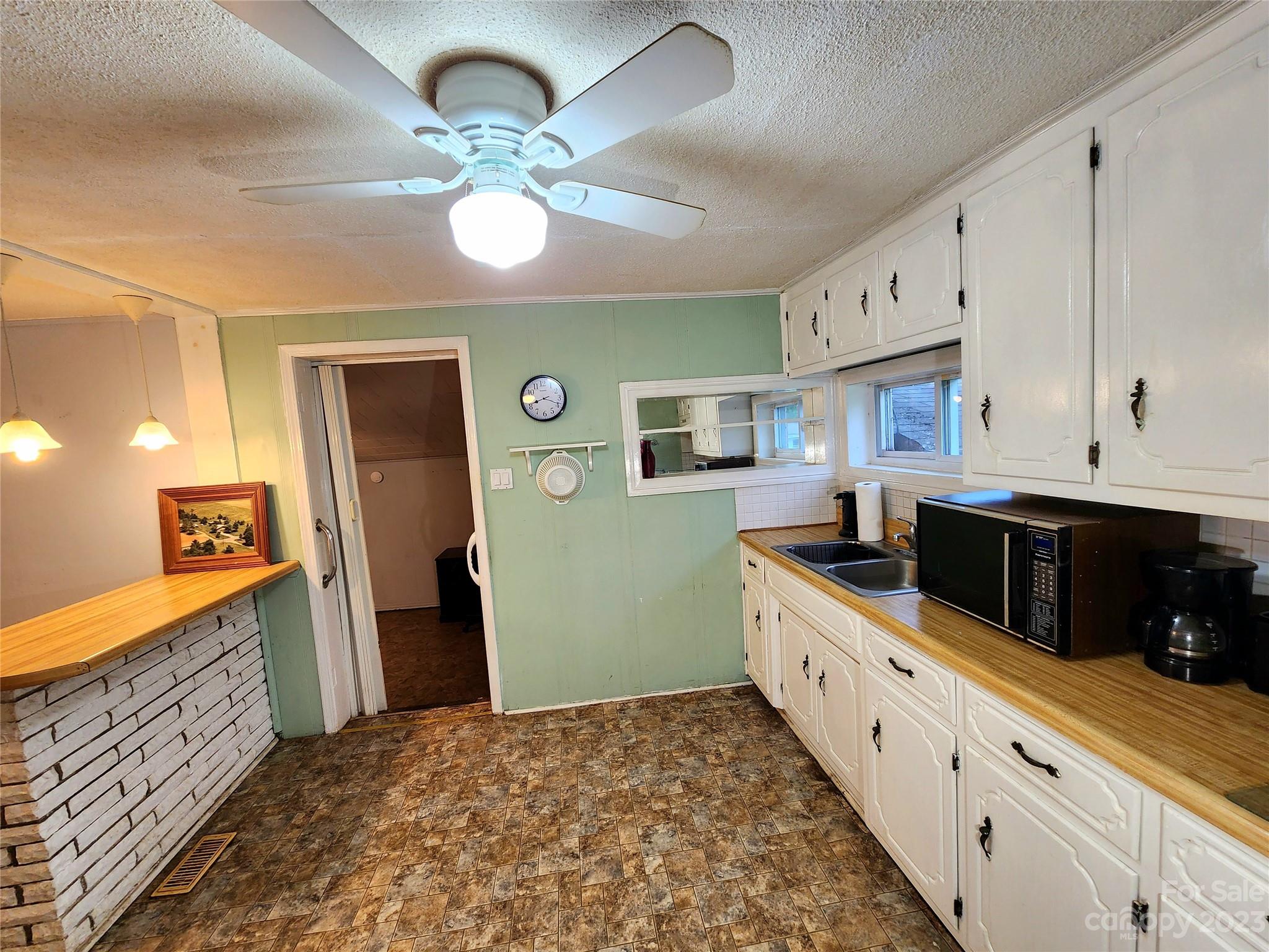 6806 Lackey Road Vale, NC 28168 - Photo 7 of 21 a kitchen with granite countertop a sink and cabinets
