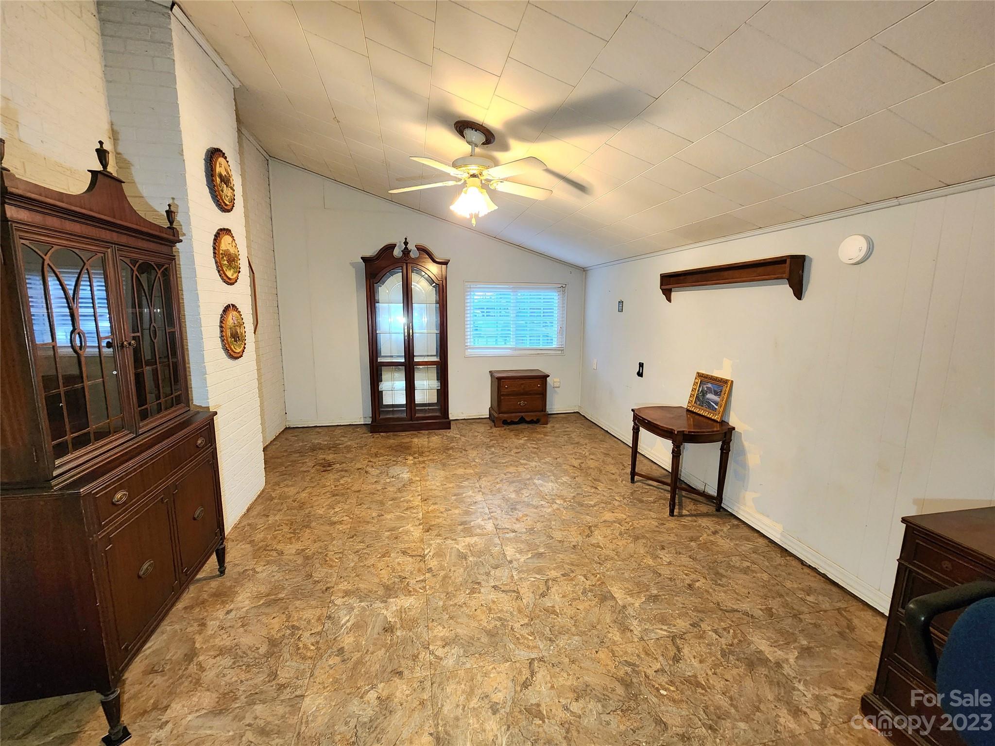 6806 Lackey Road Vale, NC 28168 - Photo 10 of 21 a view of a livingroom with furniture and a ceiling fan