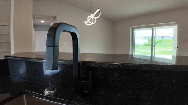 a bathroom with a sink and a window