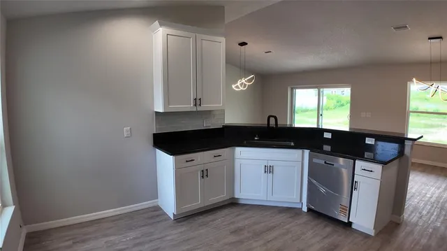 a kitchen with a sink and cabinets