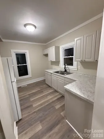 a kitchen with stainless steel appliances granite countertop a sink stove and microwave