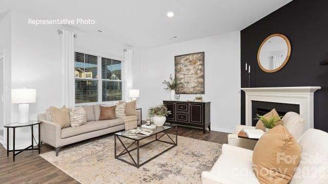 1024 Horizon Lane Chester, SC 29706 - Photo 11 of 21 a living room with furniture a fireplace and a large window