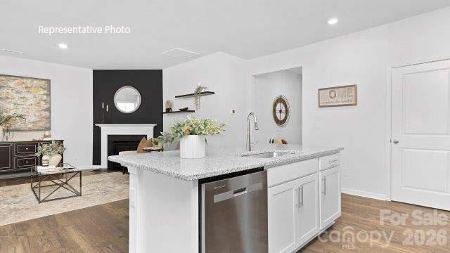 1024 Horizon Lane Chester, SC 29706 - Photo 6 of 21 a dining hall with stainless steel appliances granite countertop a sink a stove and a wooden floors