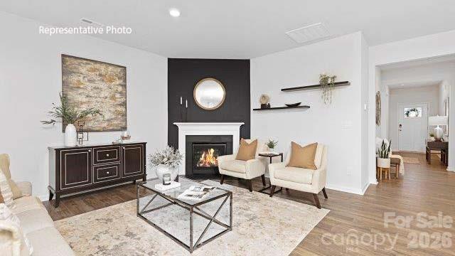 1024 Horizon Lane Chester, SC 29706 - Photo 10 of 21 a living room with furniture a fireplace and a table