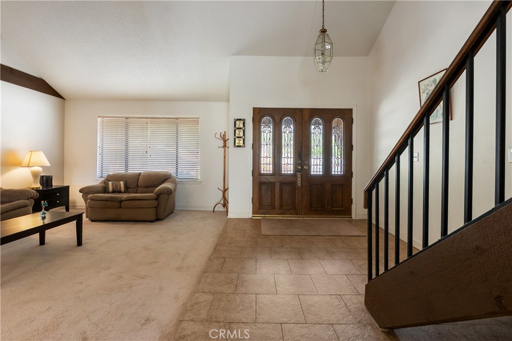 17656 Mockingbird Hill Circle Riverside, CA 92504 - Photo 7 of 49 a living room with furniture and a window