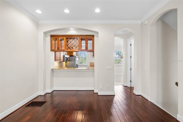 a kitchen with stainless steel appliances granite countertop a stove and a refrigerator
