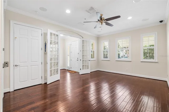 wooden floor in an empty room with a window