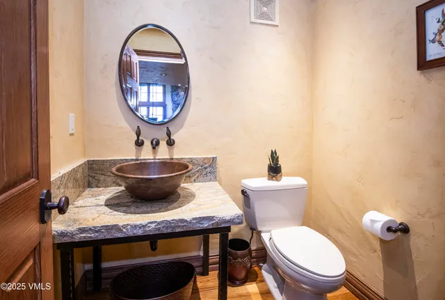 a bed room with two beds and a chair