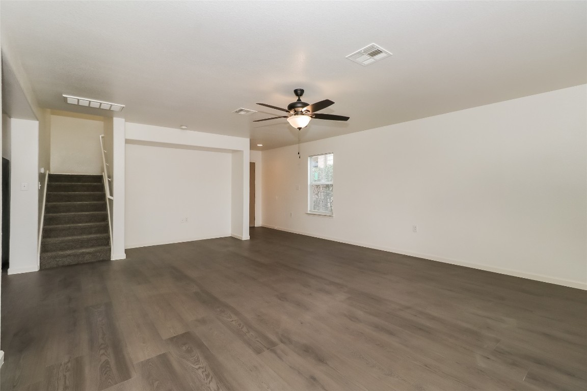 7012 Doyal Drive Austin, TX 78747 - Photo 5 of 17 a view of an empty room with a ceiling fan