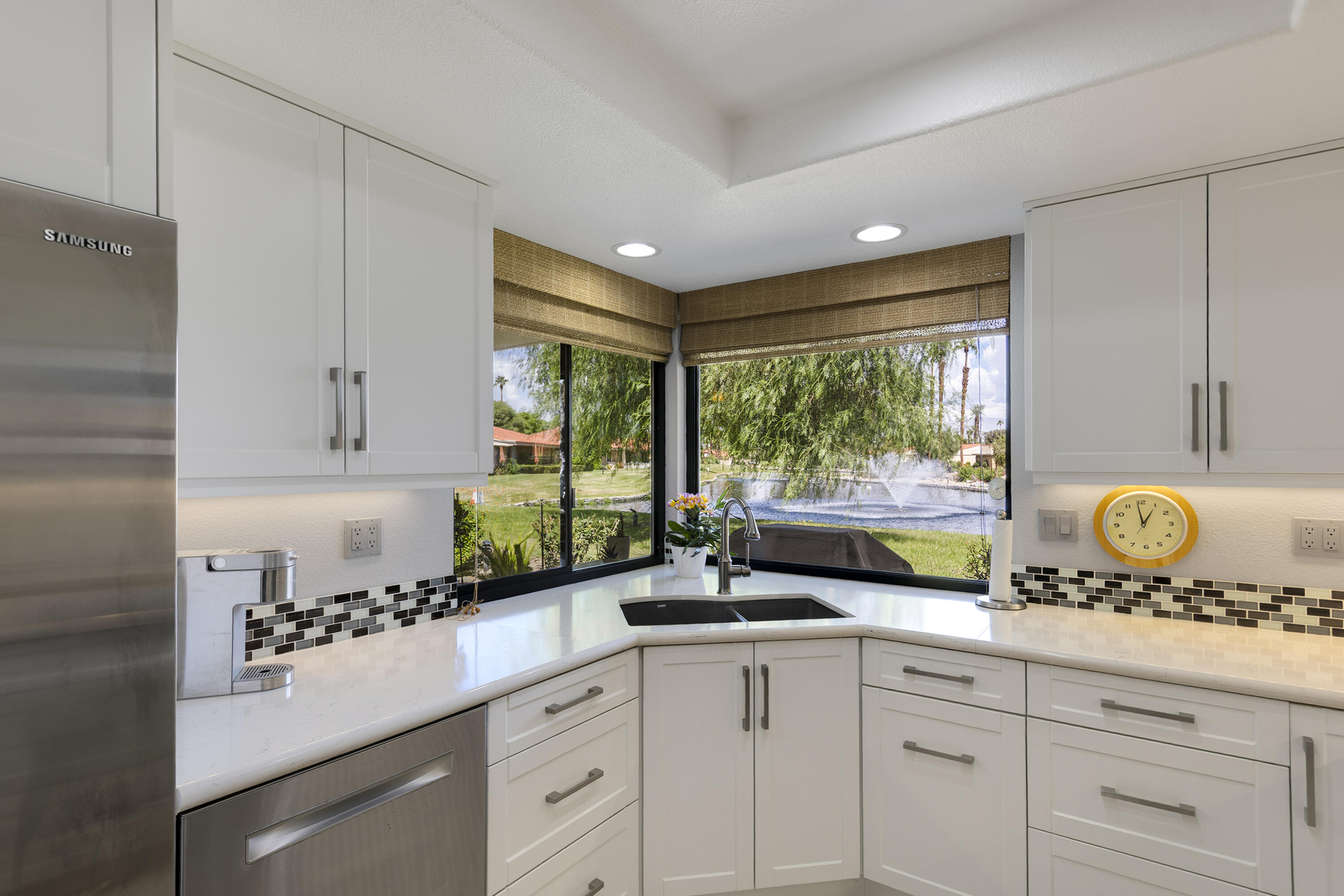 5 Valencia Drive Rancho Mirage, CA 92270 - Photo 13 of 45 a kitchen with a sink and cabinets