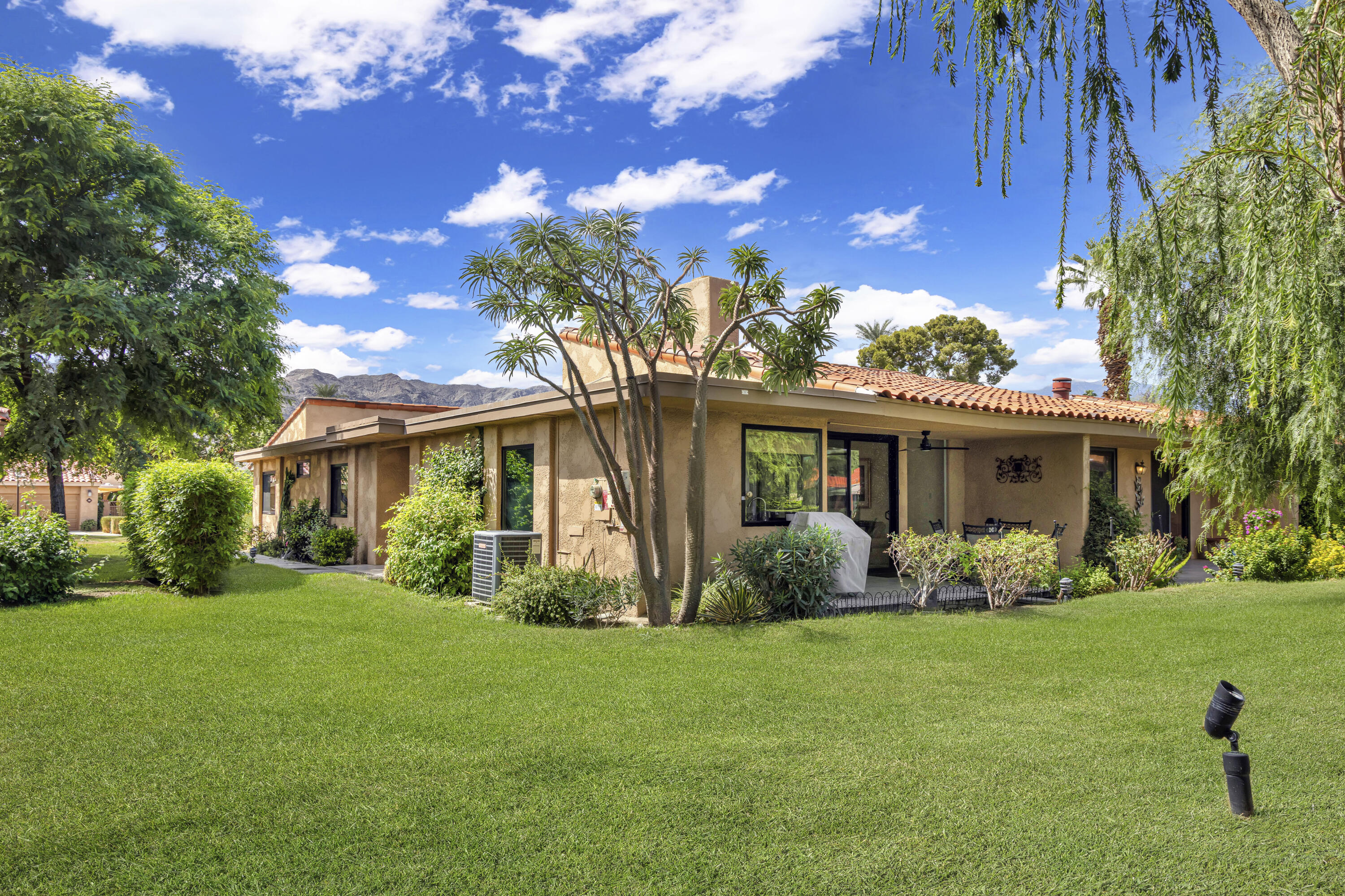 5 Valencia Drive Rancho Mirage, CA 92270 - Photo 2 of 45 a front view of a house with garden