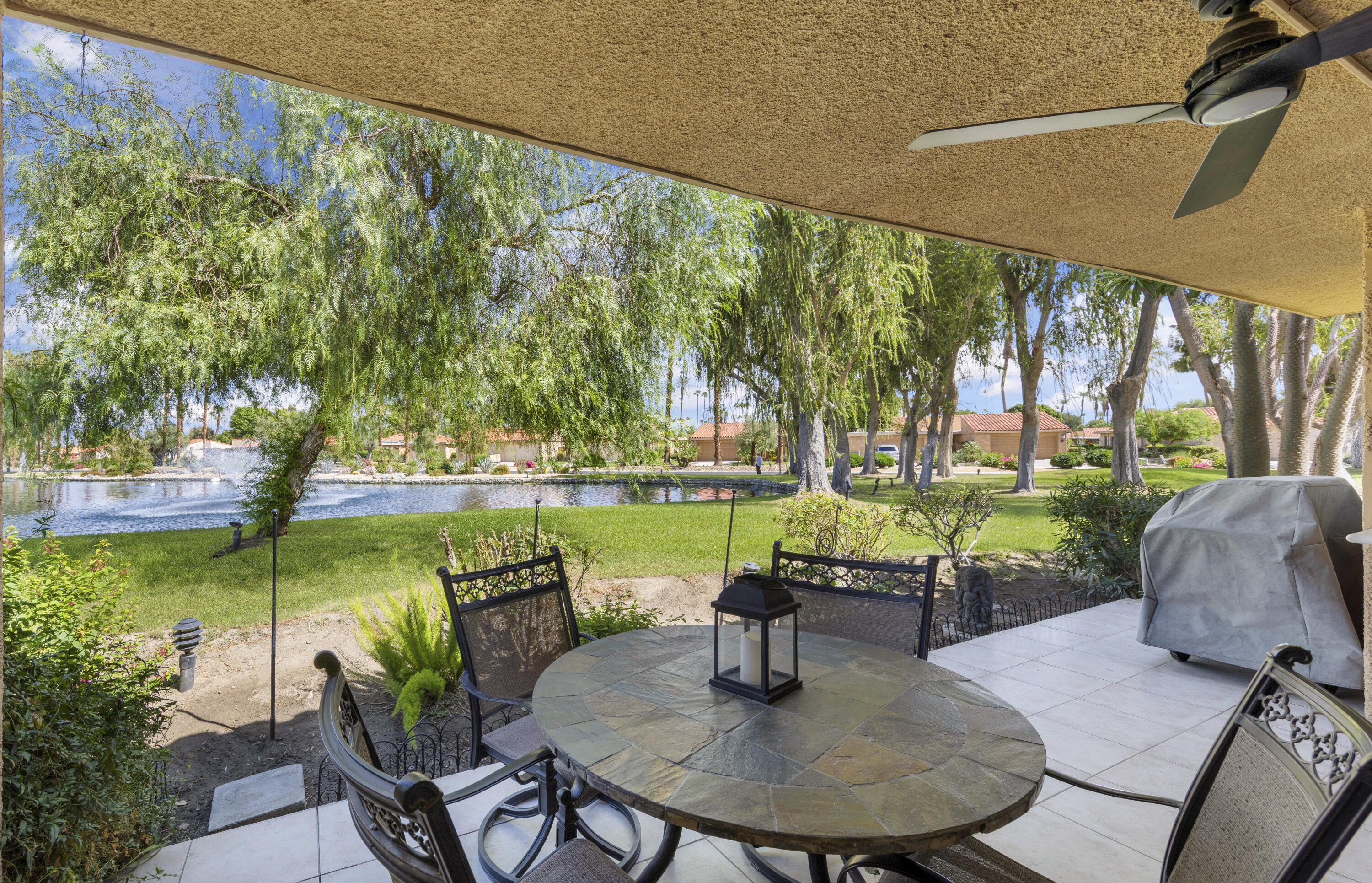 5 Valencia Drive Rancho Mirage, CA 92270 - Photo 4 of 45 a swimming pool with outdoor seating and plants