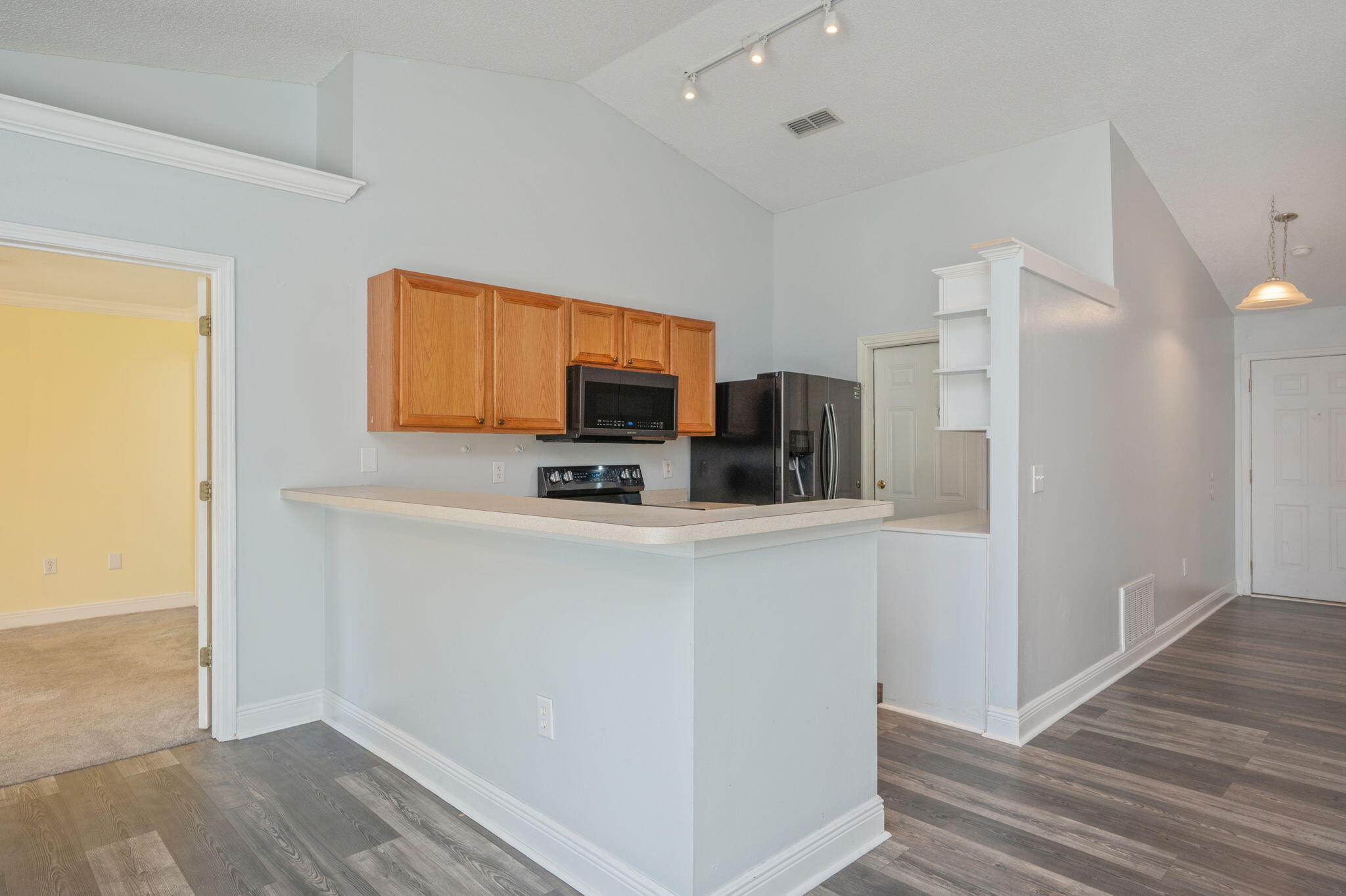 410 Winddrift Court Crestview, FL 32536 - Photo 11 of 44 a kitchen with stainless steel appliances a refrigerator and a stove top oven