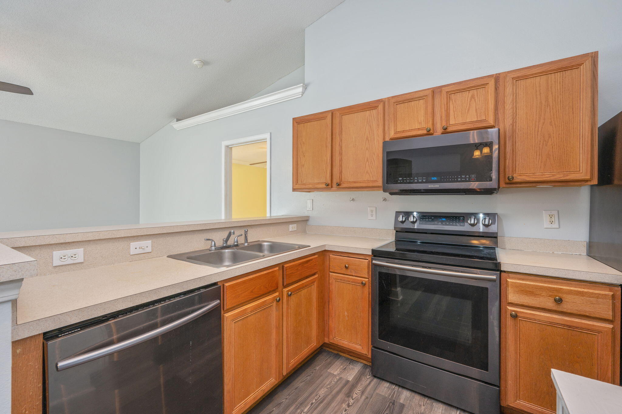 410 Winddrift Court Crestview, FL 32536 - Photo 12 of 44 a kitchen with a sink stove and microwave