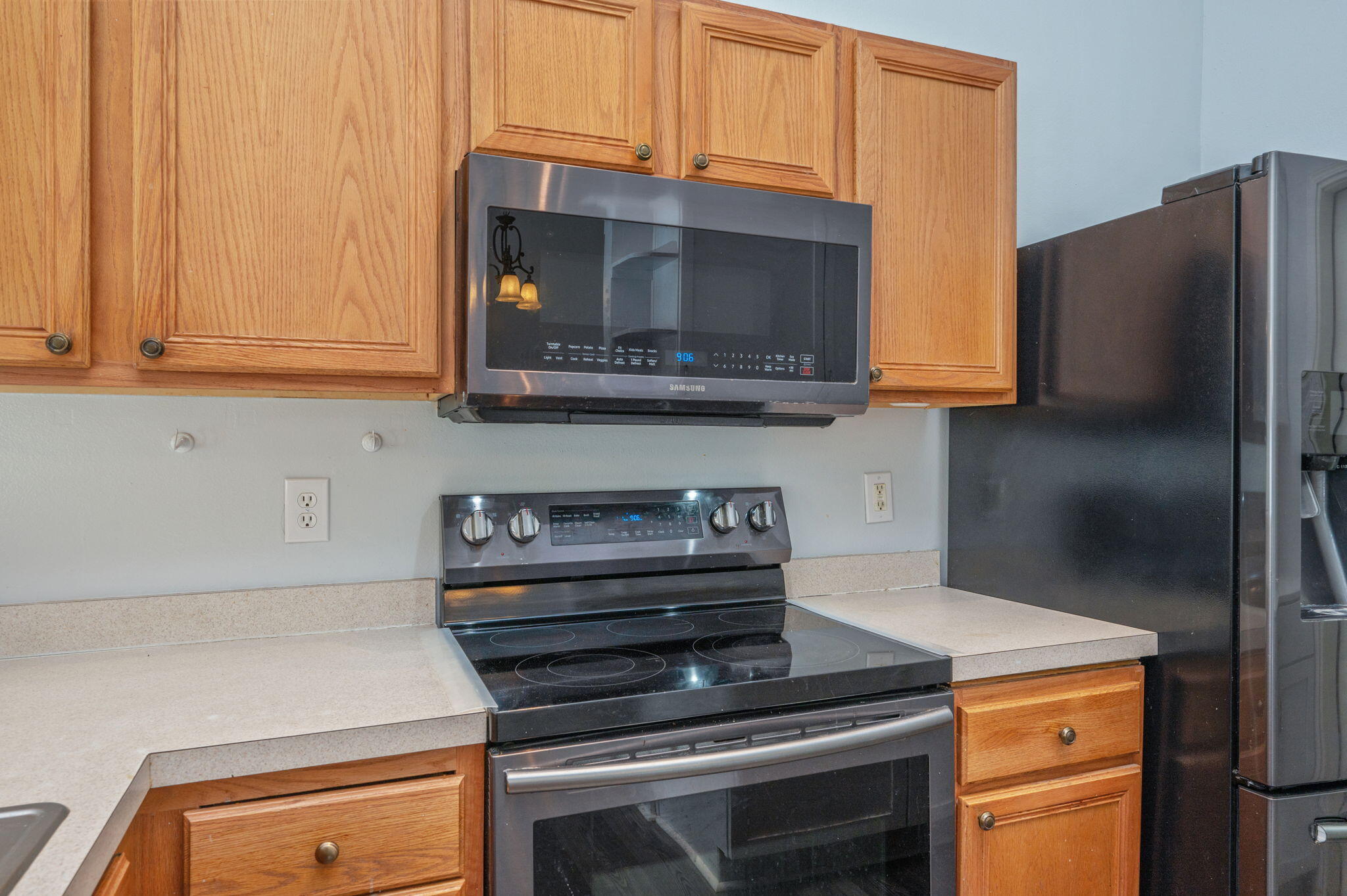 410 Winddrift Court Crestview, FL 32536 - Photo 14 of 44 a kitchen with wooden cabinets and a stove top oven
