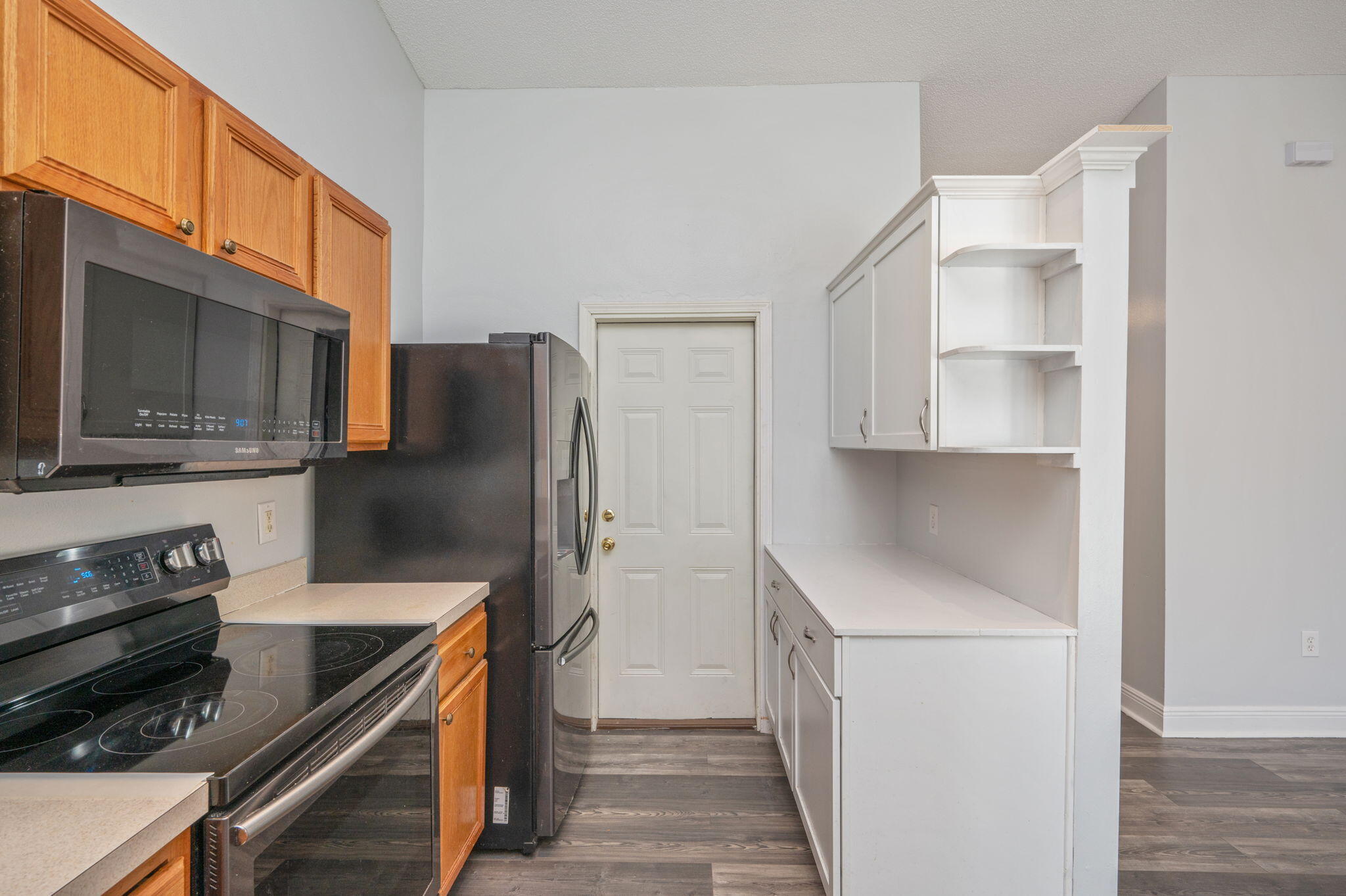410 Winddrift Court Crestview, FL 32536 - Photo 15 of 44 a kitchen with stainless steel appliances a refrigerator stove and microwave