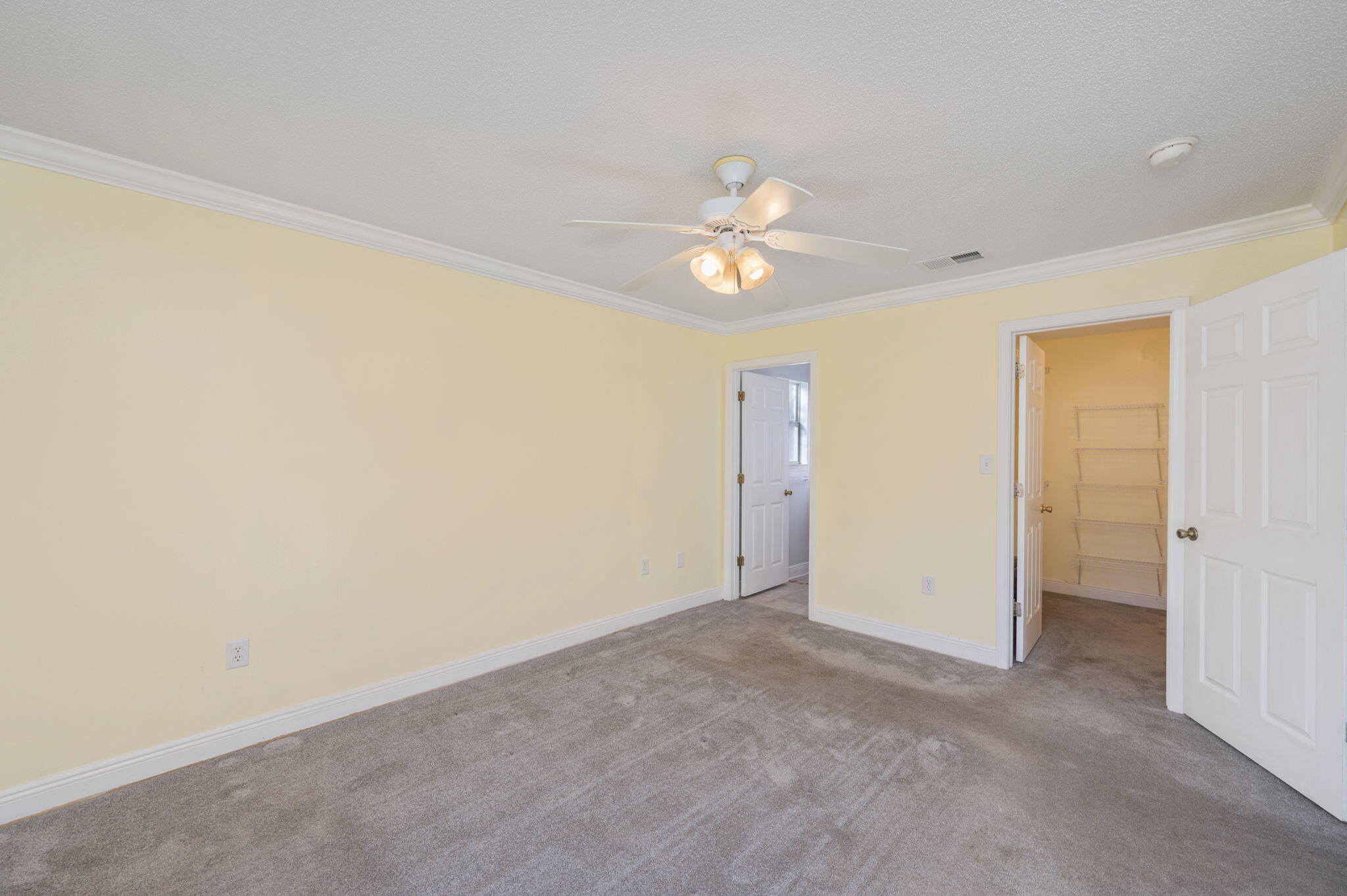 410 Winddrift Court Crestview, FL 32536 - Photo 18 of 44 an empty room with a ceiling fan and a window