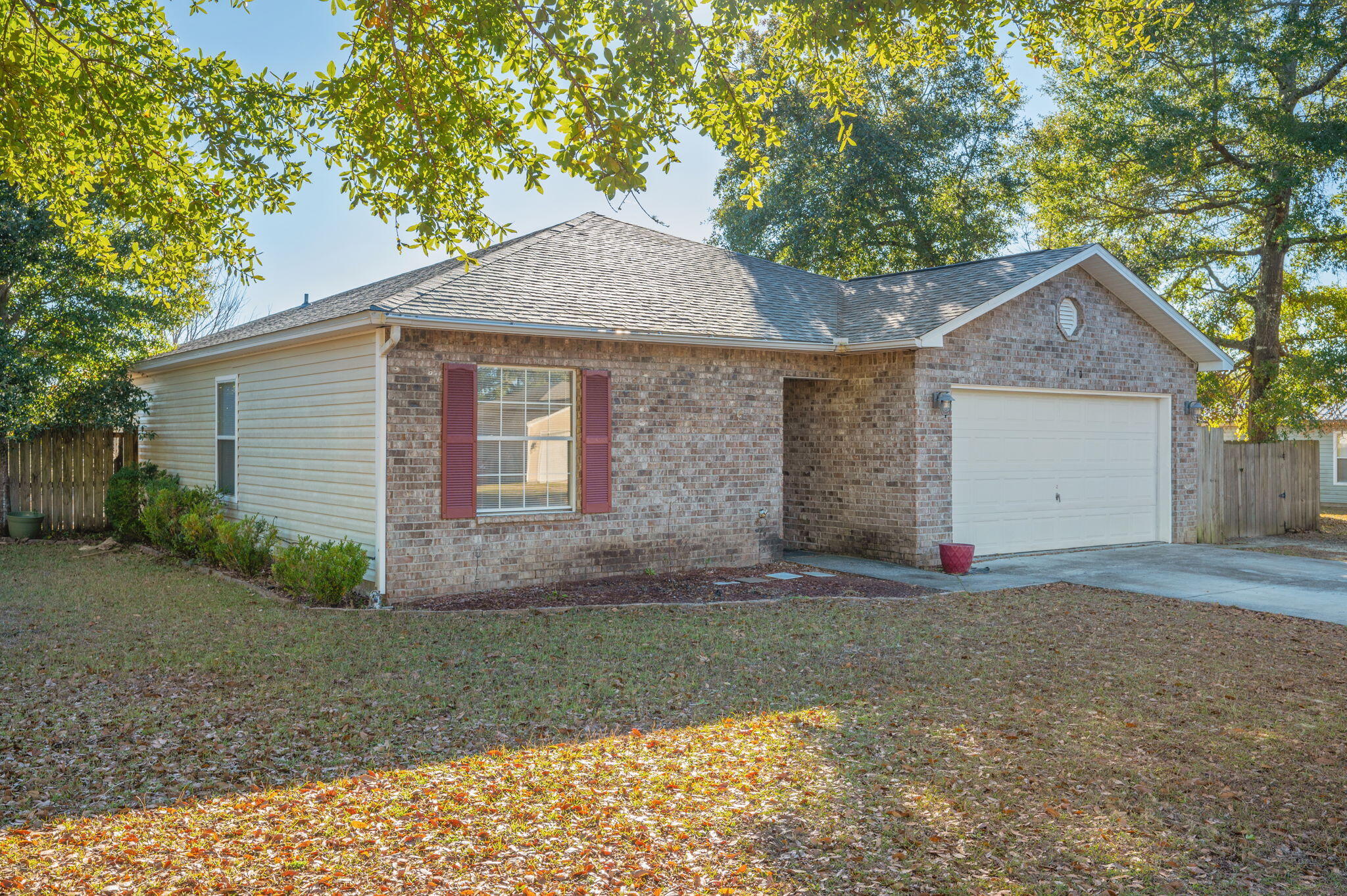410 Winddrift Court Crestview, FL 32536 - Photo 2 of 44 a front view of a house with a yard and garage
