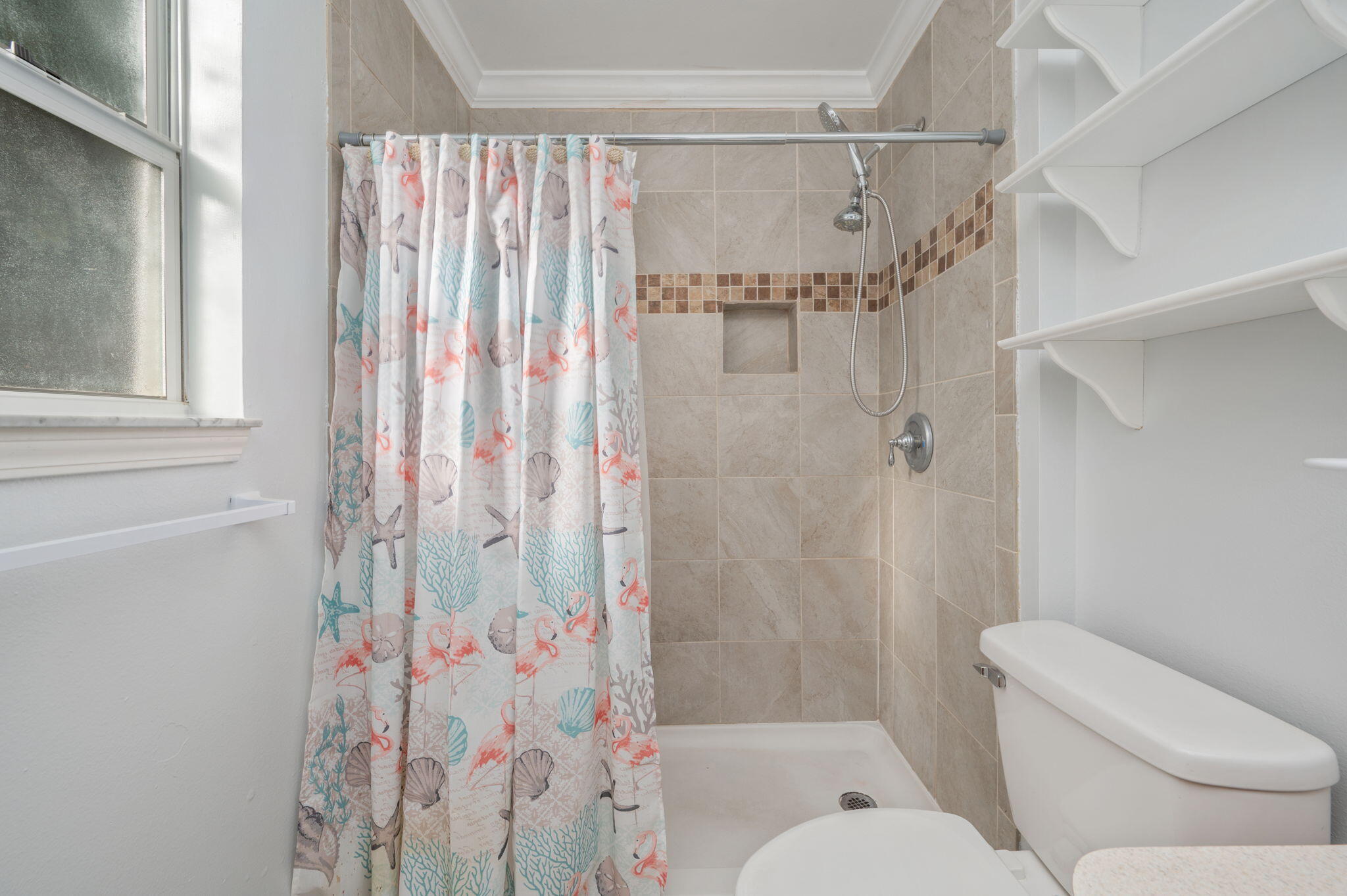 410 Winddrift Court Crestview, FL 32536 - Photo 21 of 44 a bathroom with a shower curtain and a toilet