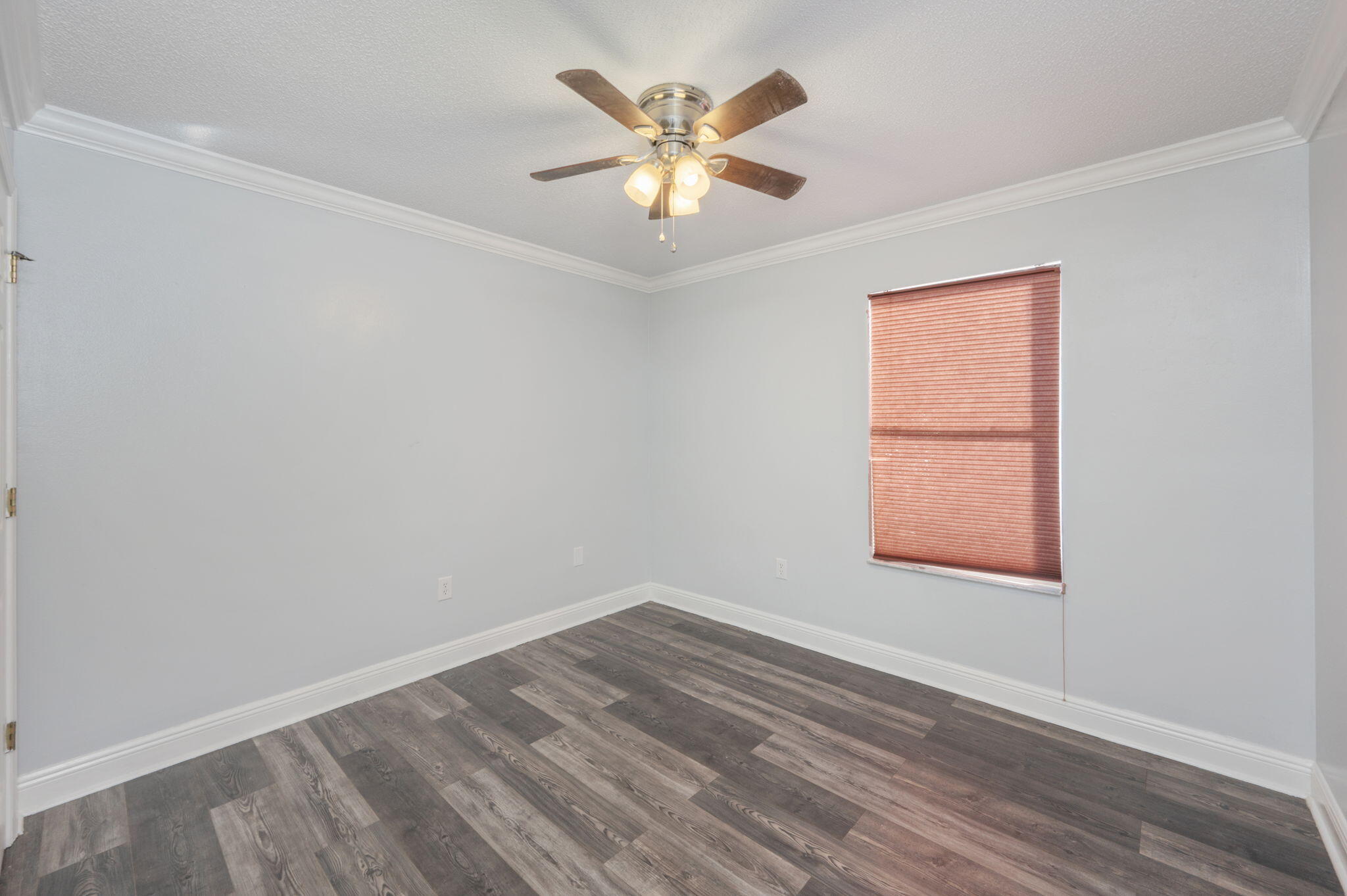 410 Winddrift Court Crestview, FL 32536 - Photo 24 of 44 wooden floor in an empty room with a window