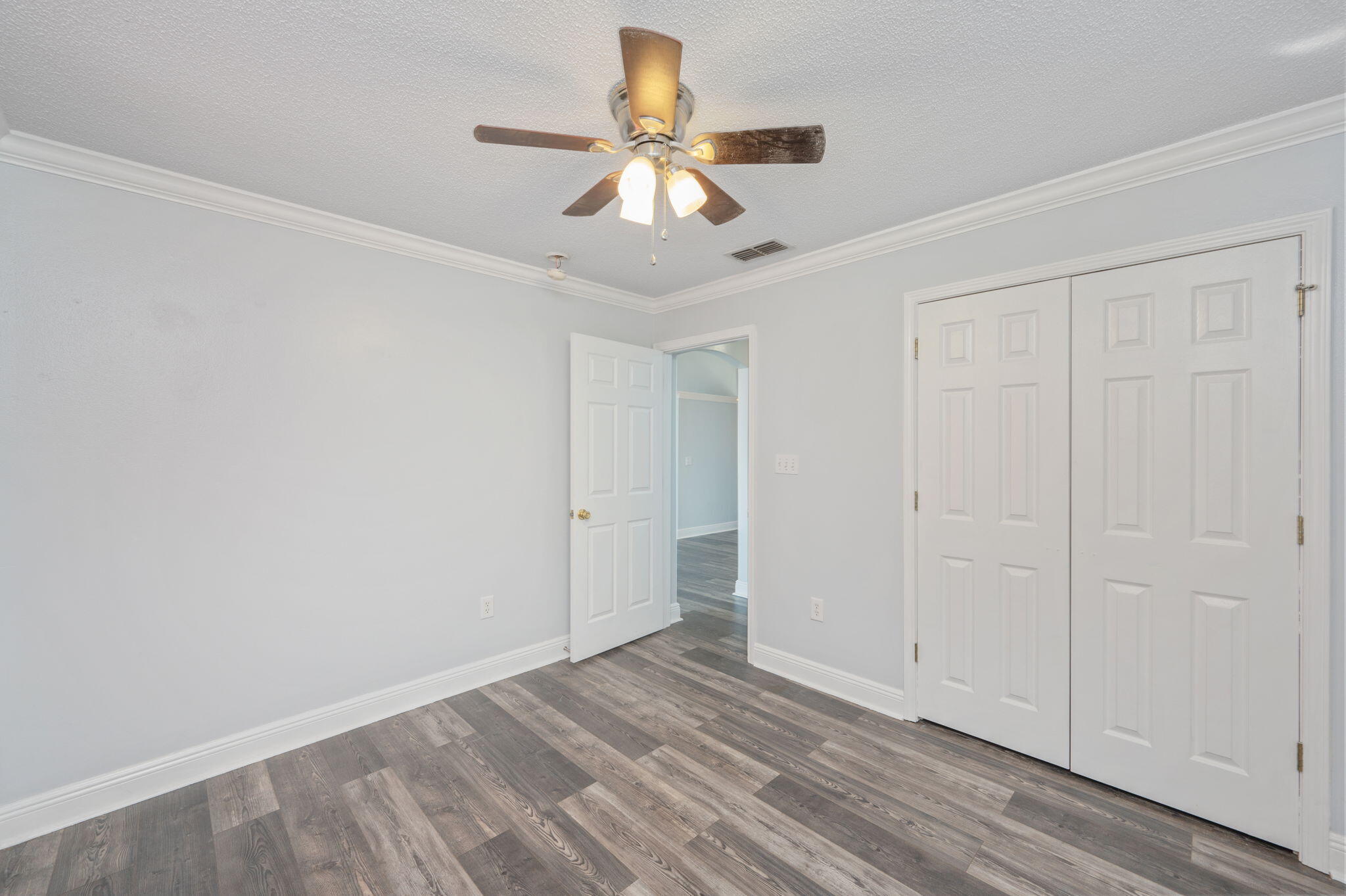 410 Winddrift Court Crestview, FL 32536 - Photo 25 of 44 wooden floor in an empty room with a window