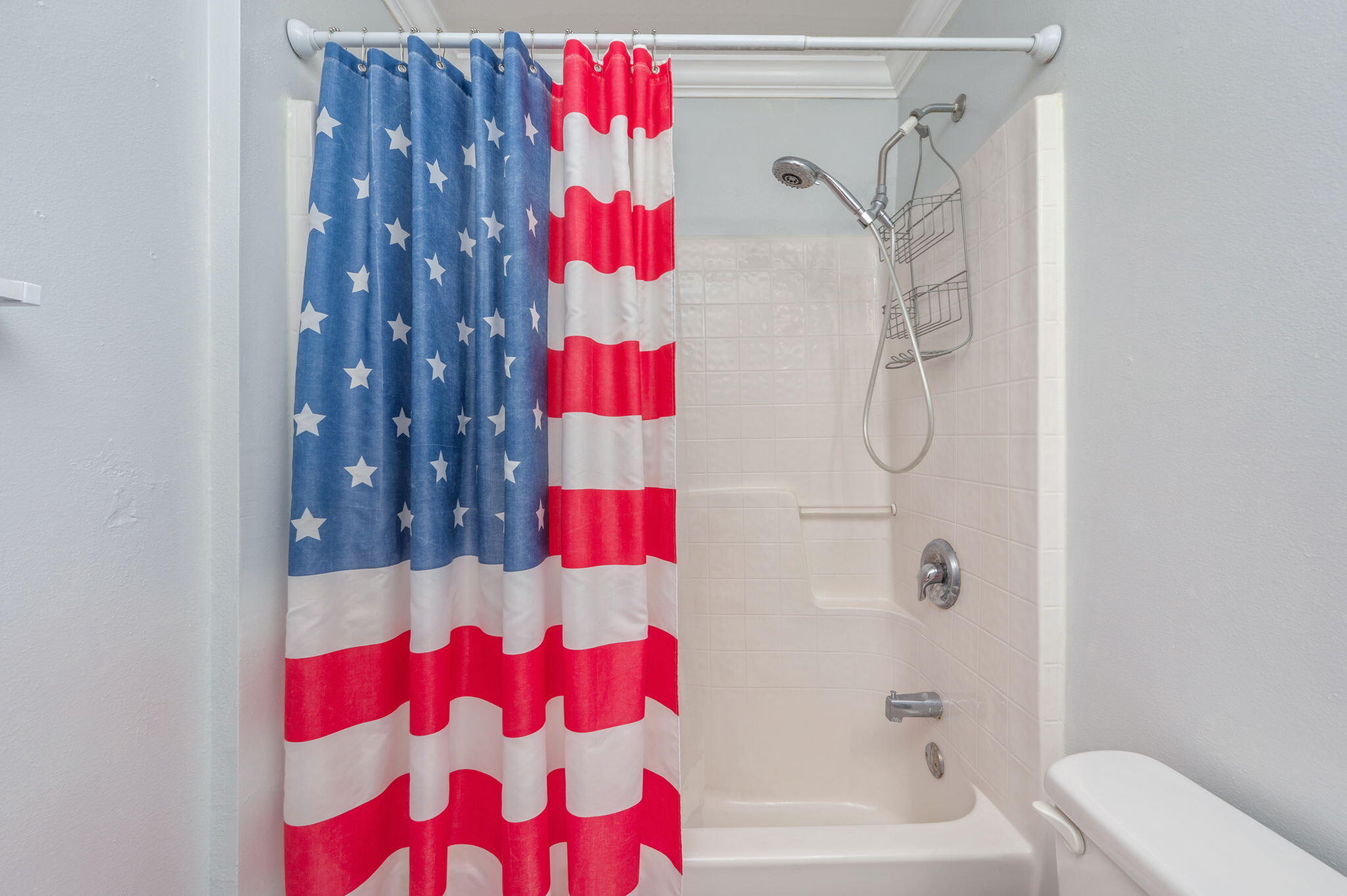 410 Winddrift Court Crestview, FL 32536 - Photo 29 of 44 a bathroom with a shower curtain and a bath tub