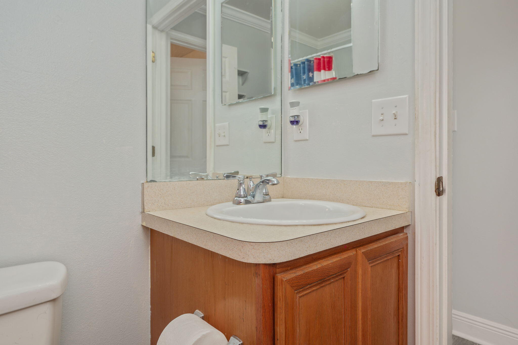 410 Winddrift Court Crestview, FL 32536 - Photo 30 of 44 a bathroom with a sink and a mirror