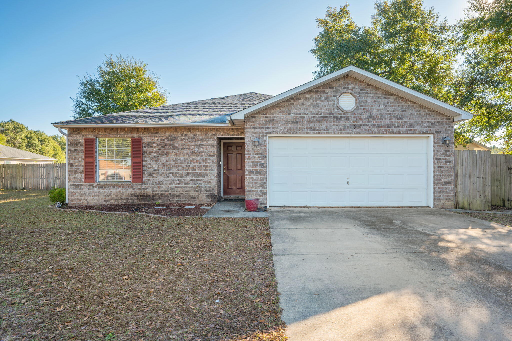 410 Winddrift Court Crestview, FL 32536 - Photo 3 of 44 a front view of a house with a yard and garage