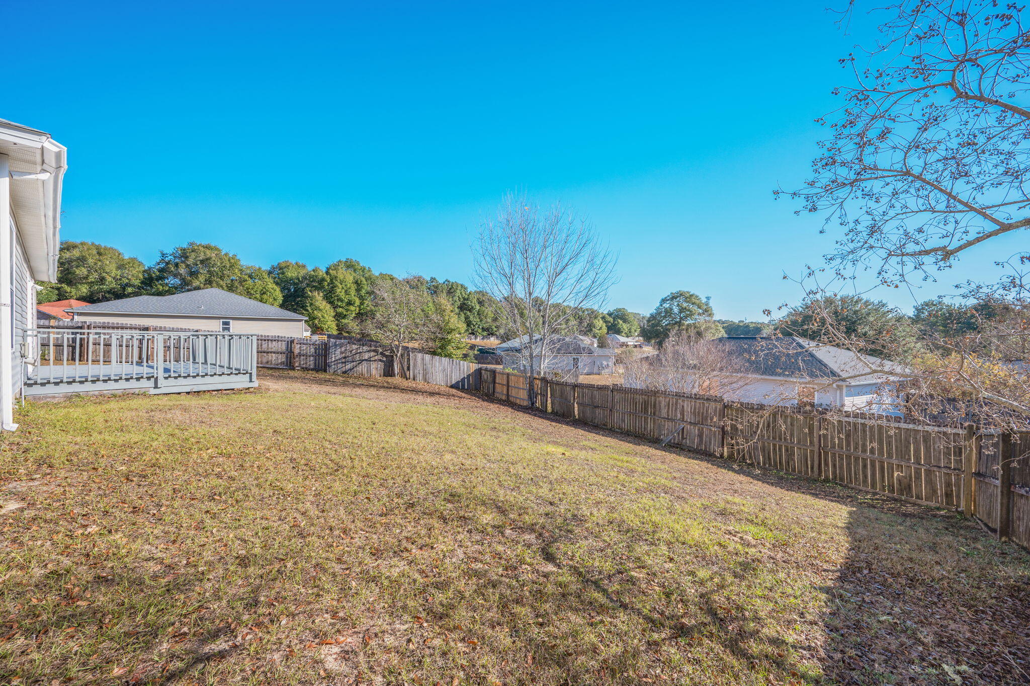 410 Winddrift Court Crestview, FL 32536 - Photo 38 of 44 a view of a swimming pool with an outdoor seating and a garden