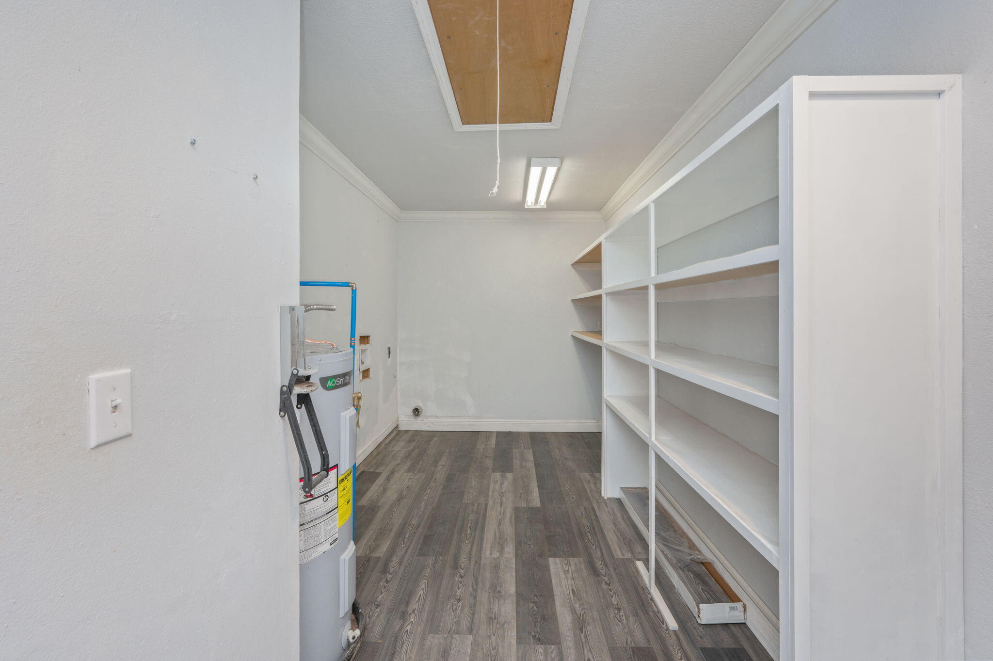410 Winddrift Court Crestview, FL 32536 - Photo 40 of 44 a view of a hallway with wooden floor and entryway