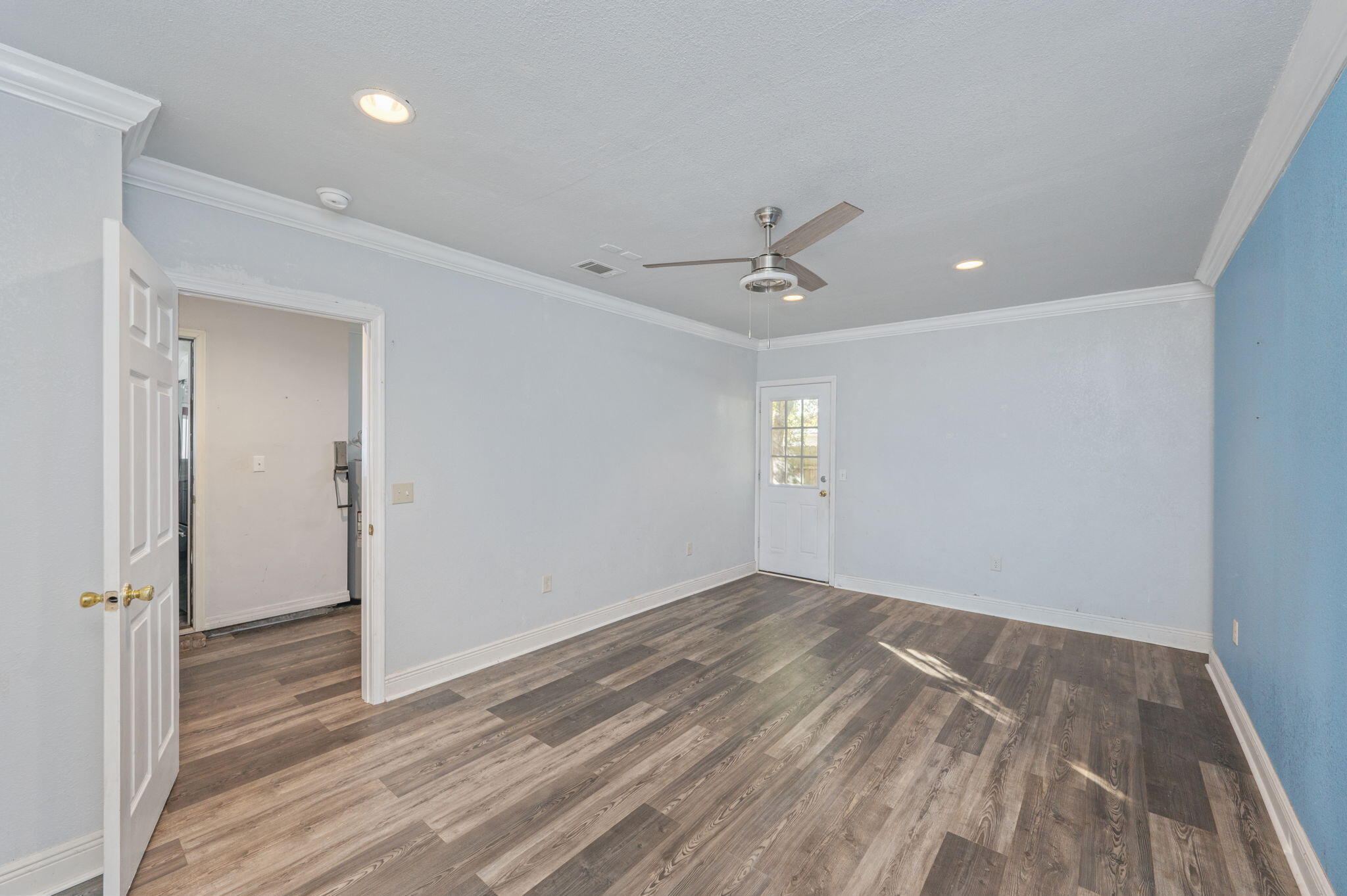410 Winddrift Court Crestview, FL 32536 - Photo 43 of 44 wooden floor in an empty room with a window