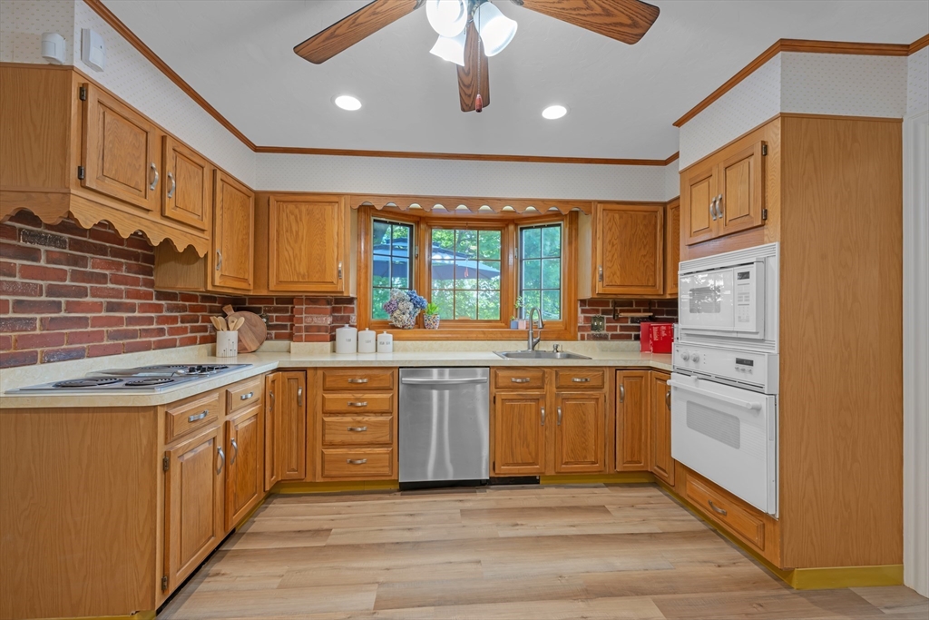 71 Morningside Road Worcester, MA 01602 - Photo 6 of 42 a kitchen with stainless steel appliances granite countertop a stove and a sink