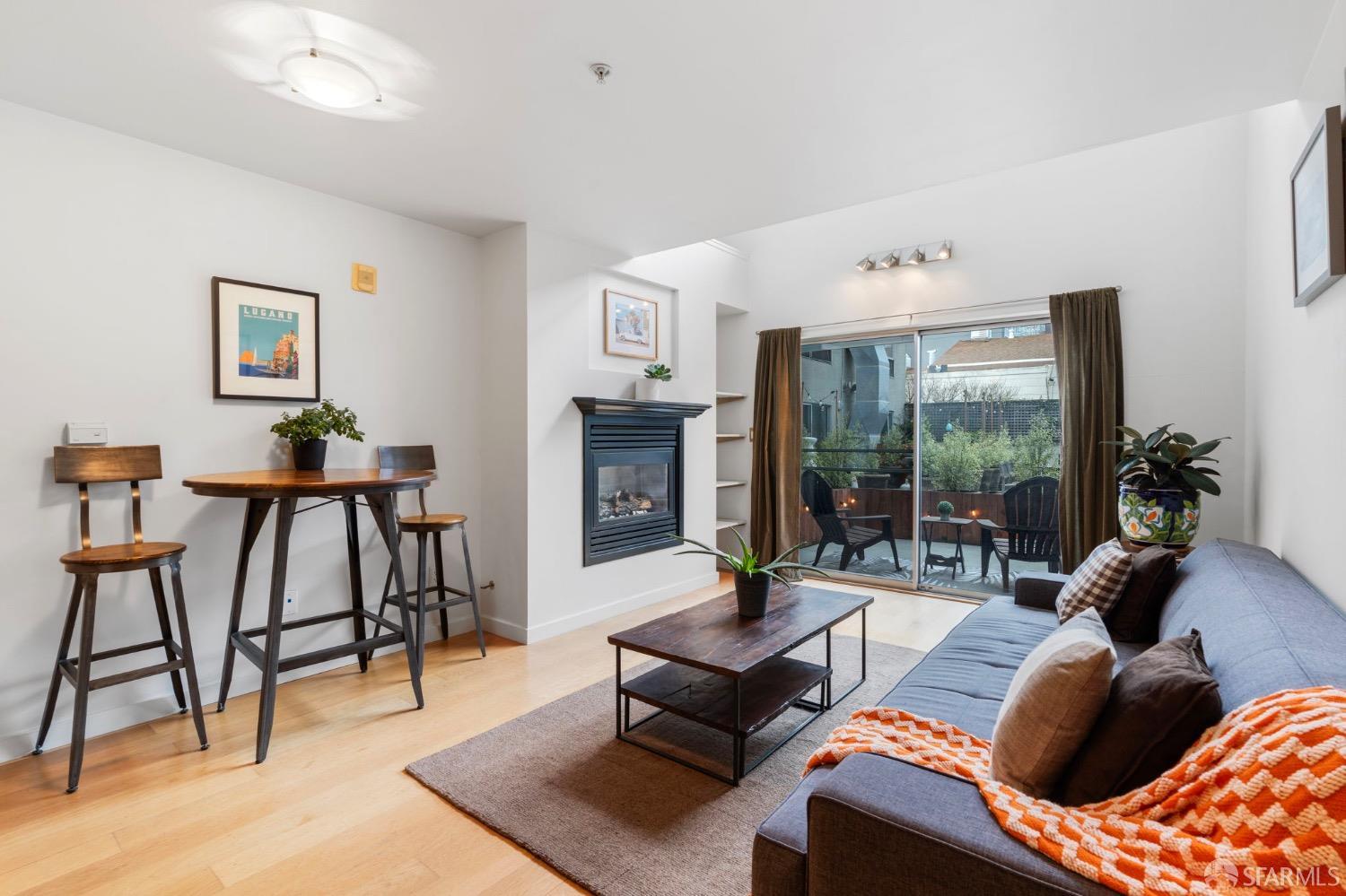 a living room with furniture and a floor to ceiling window