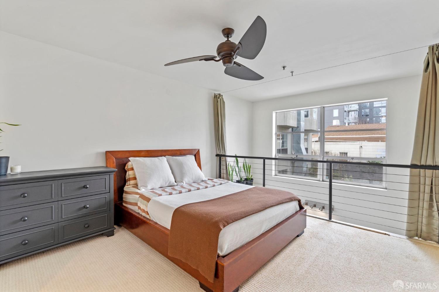 1720 Clay Street, Unit 8 San Francisco, CA 94109 - Photo 17 of 37 a large bed sitting in a room next to a window