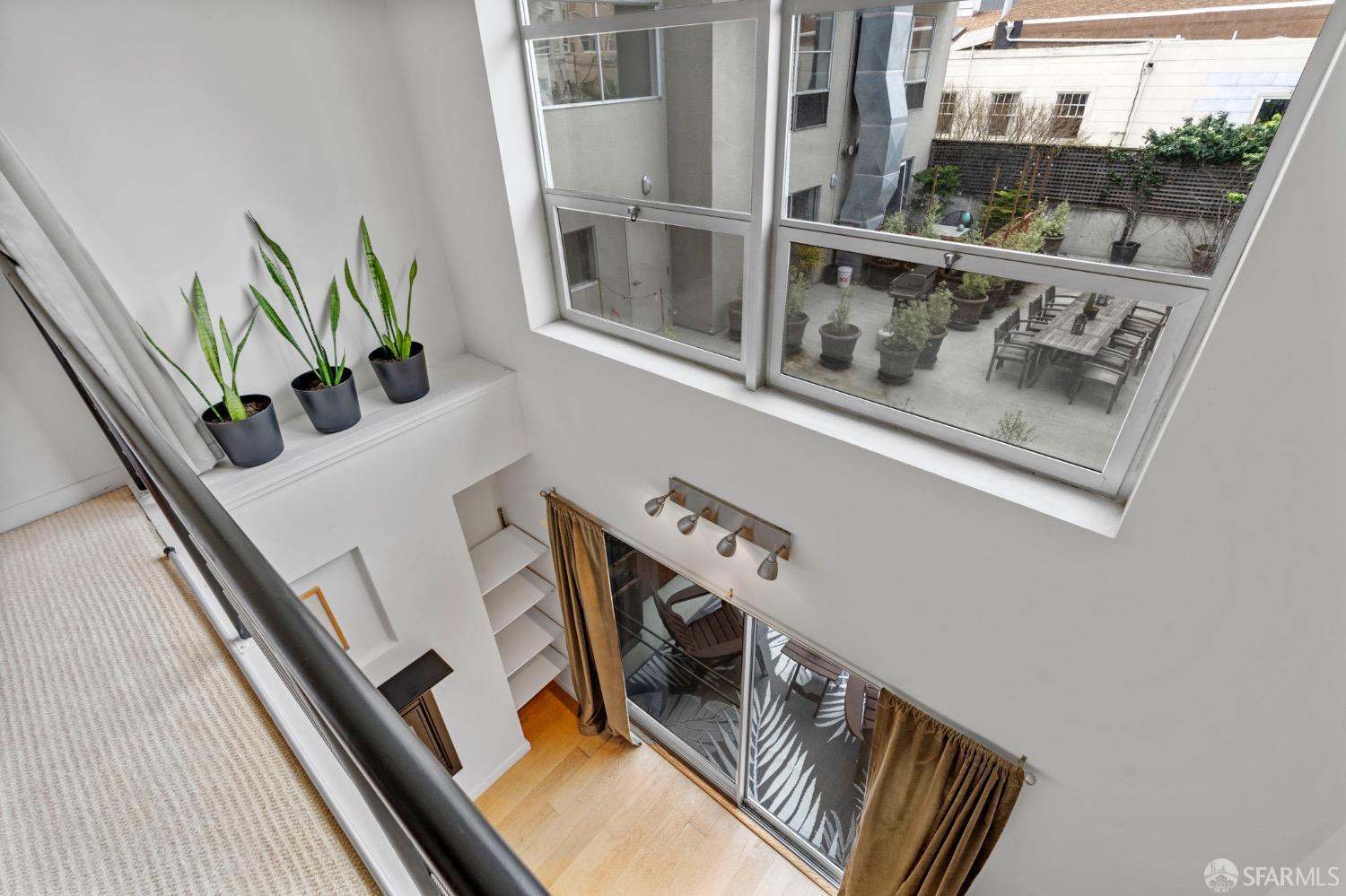 1720 Clay Street, Unit 8 San Francisco, CA 94109 - Photo 20 of 37 a view of a balcony with furniture and floor to ceiling window