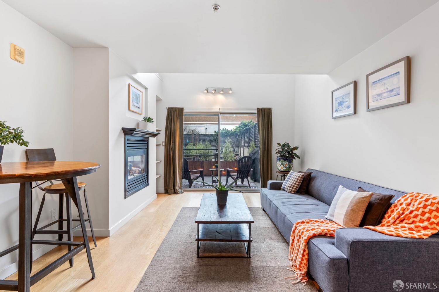 1720 Clay Street, Unit 8 San Francisco, CA 94109 - Photo 2 of 37 a living room with furniture and a large window