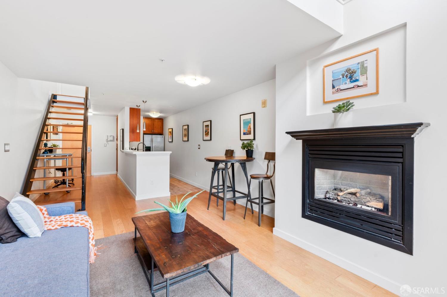 1720 Clay Street, Unit 8 San Francisco, CA 94109 - Photo 3 of 37 a living room with furniture and a fireplace