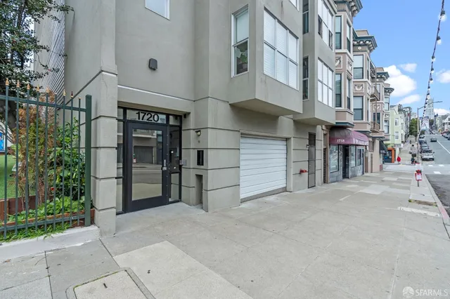 a view of a street with an apartment