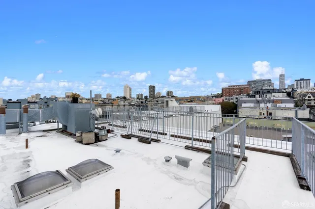 a view of roof deck with a barbeque and stove