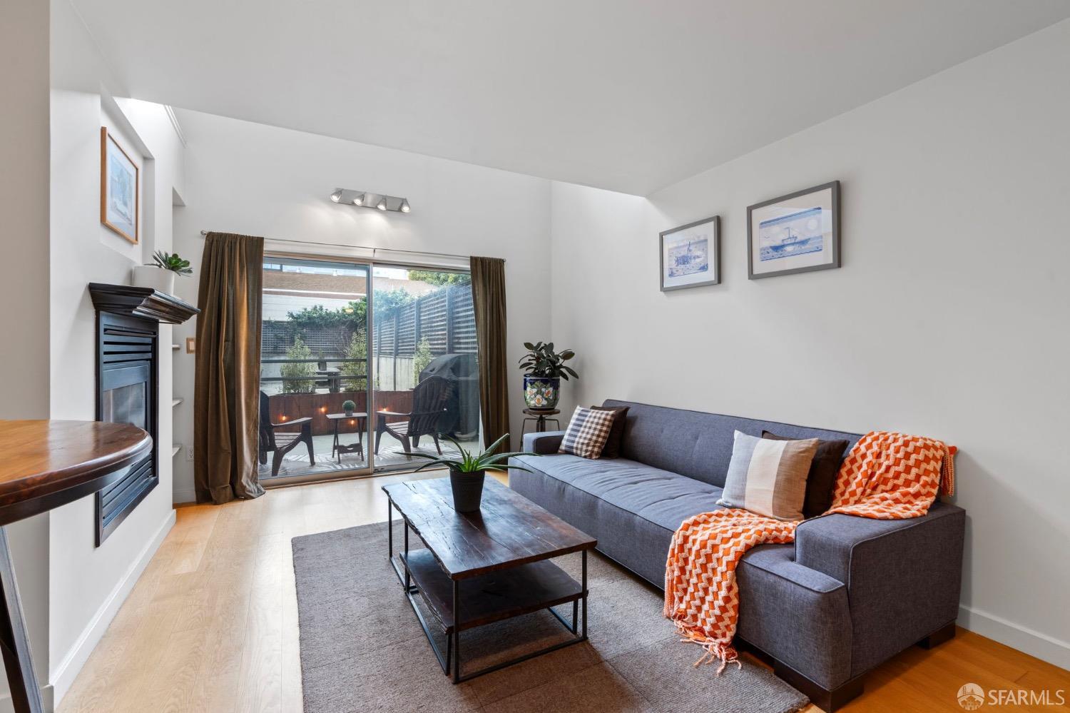 1720 Clay Street, Unit 8 San Francisco, CA 94109 - Photo 4 of 37 a living room with furniture and a large window