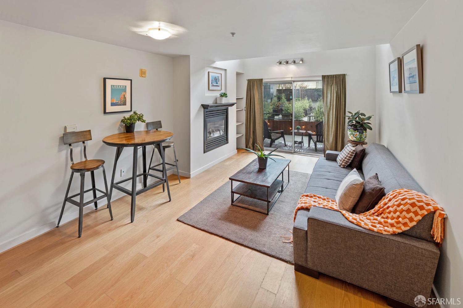 1720 Clay Street, Unit 8 San Francisco, CA 94109 - Photo 5 of 37 a living room with furniture and large windows