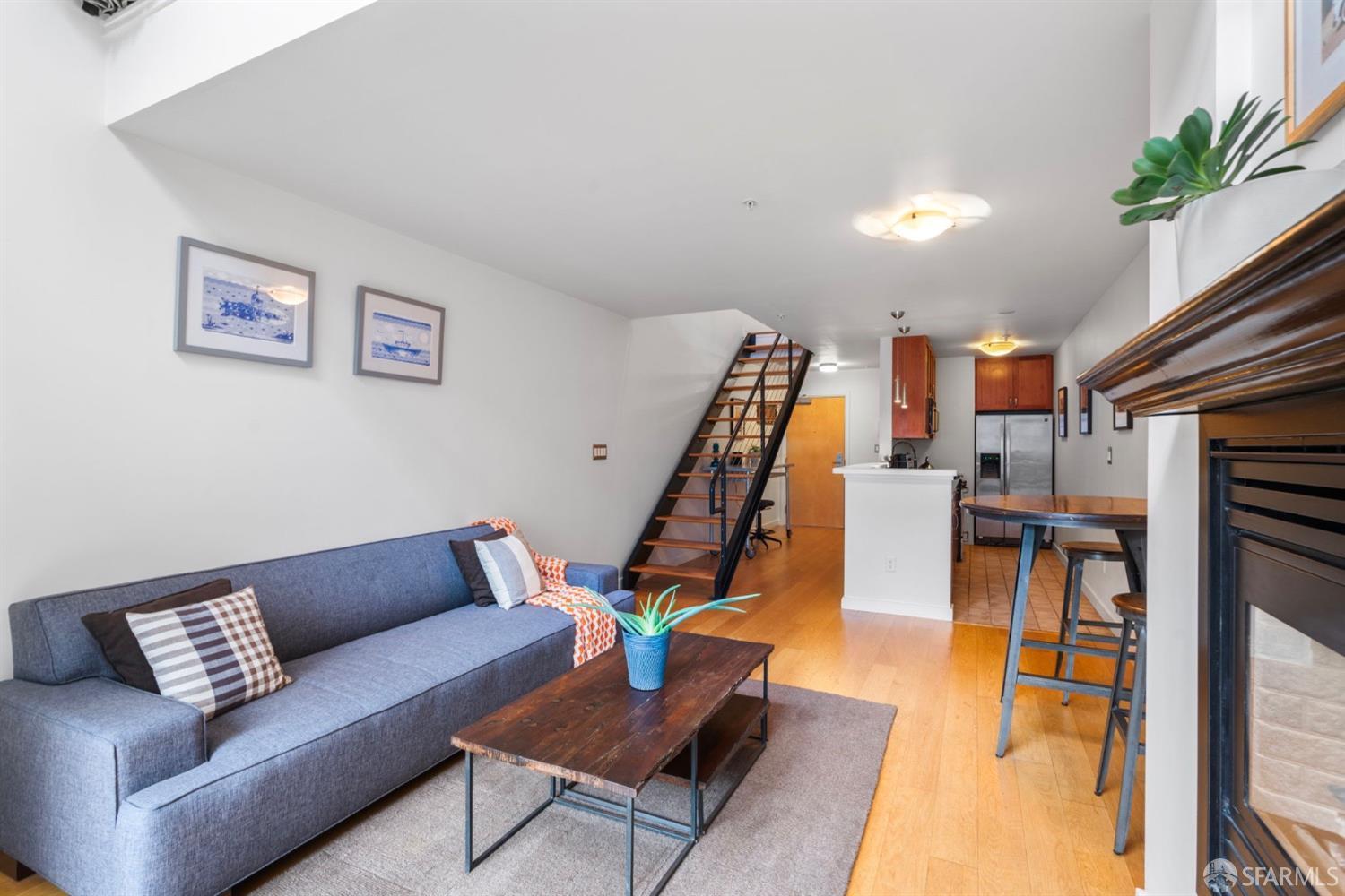 1720 Clay Street, Unit 8 San Francisco, CA 94109 - Photo 9 of 37 a living room with furniture and a wooden floor