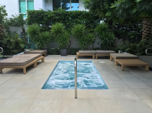 a backyard of a house with outdoor seating